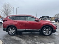 Command the road in the breathtaking Radiant Red Metallic 2021 Honda CR-V Touring, a sophisticated s... (image 3)
