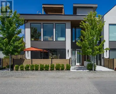 Stunning luxury townhome in the heart of Kelowna South, just steps to beaches, restaurants, shops, a...