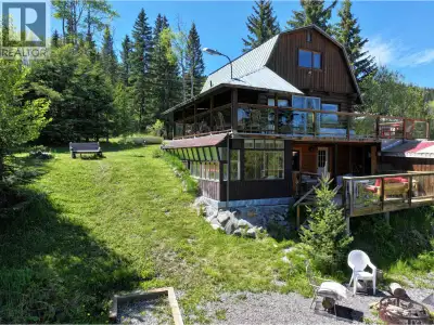 Rare Waterfront Log Home on Peaceful Hathaway Lake. Discover this charming 2-bedroom, 2-bathroom yea...