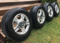 4 TOYO OPEN COUNTRY WINTER TIRES ON FORD F150 WHEELS 245/70/17