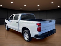 The 2023 Chevrolet Silverado 1500 Crew Cab Short Box 4-Wheel Drive Work Truck, in crisp white with a... (image 7)
