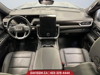 The 2025 GMC Yukon XL Elevation 4WD commands attention with bold styling, extended cargo versatility... (image 9)