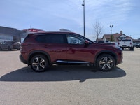 This pre-owned 2023 Nissan Rogue Platinum is finished in a beautiful Red paint with a refined Graphi... (image 7)