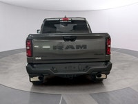 Meet the 2026 Ram 1500 Rebel 4x4 Crew Cab 57 Box: a commanding presence in a refined gray shade. Bui... (image 3)