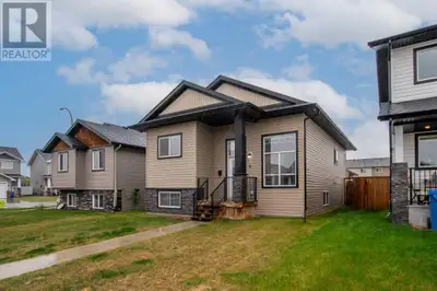 A fully developed bilevel with a detached double car garage. The curb appeal is accented by the cove...