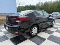 A practical compact sedan with efficient performance, modern convenience features, and a comfortable... (image 3)