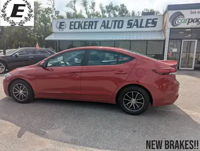 Introducing the vibrant Red 2017 Hyundai Elantra LE, a fantastic compact sedan ready to hit the road...