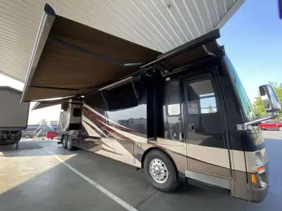 The Mountain Aire 4369 motor home by Newmar offers triple slides and a bath and a half. As you enter...