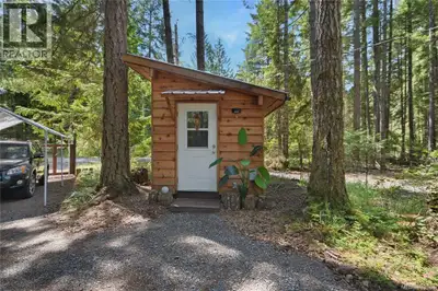 This fantastic level .4 acre land has 3 out buildings (studio, bunkie and tool shed)! An ideal recta...