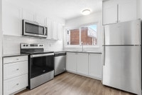 Fully renovated spacious 2 & 3 bedroom townhomes features kitchen with modern features and finishes... (image 2)