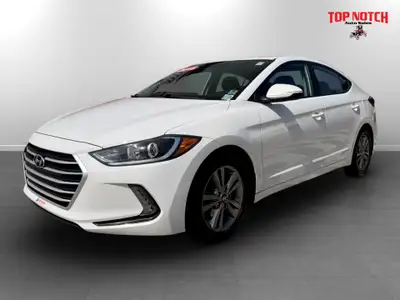 a practical compact sedan known for its reliability and value. It features a fuel-efficient 2.0L eng...