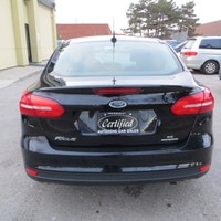 This 2016 Ford Focus SE is a reliable sedan with a sleek black exterior and a stylish charcoal inter... (image 7)