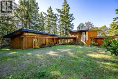 Glass, wood, concrete and stone: set on a stunning west-facing oceanfront lot, this custom home by M...