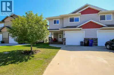 IMMEDIATE POSSESSION AVAILABLE ~ FULLY DEVELOPED 2 BEDROOM, 2 BATH MODIFIED BI-LEVEL ~ ATTACHED GARA...