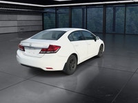 The 2014 Honda Civic Sedan LX, in a pristine white finish and equipped with a smooth front-wheel-dri... (image 7)