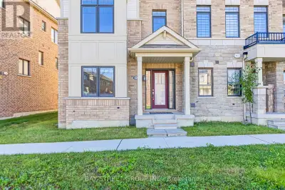 Spacious almost 2500 Sq Ft End Unit of freehold Townhouse, Direct Access Double Garage plus 2 covere...
