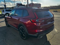 Welcome to Cumberland Honda 2026 Honda CR-V Hybrid Touring Radiant Red Metallic AWD CVT 2.0L 16V DOH... (image 7)