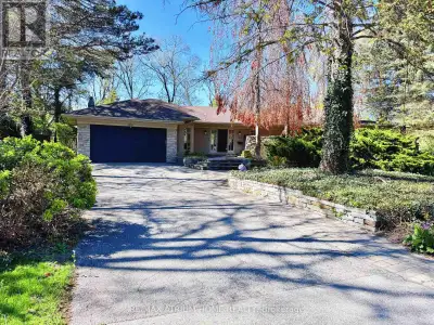Executive bungalow in prestigious Eastlake offering 5431 sqft of finished space on a mature, natural...