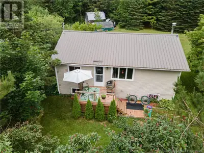 Located on a beautifully landscaped 2-acre lot offering privacy and outdoor enjoyment, this well-mai...