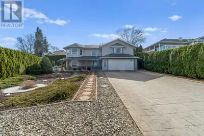 Lakeview Gem in a Parklike Setting! This beautifully maintained 5-bedroom, 3-bathroom home is nestle...