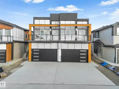 FINISHED BASEMENT + SPICE KITCHEN + OPEN TO BELOW + PRIMARY SUITE BALCONY. Welcome to this stunning...