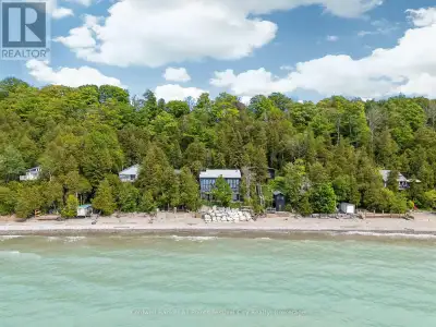 Escape to your dream retreat on Lake Huron with this stunning cottage. Featuring expansive floor-to-...