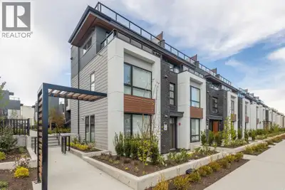 This spacious garden-level home offers 901 sf of living space with 2 bedrooms, a flex room, and 2 ba...