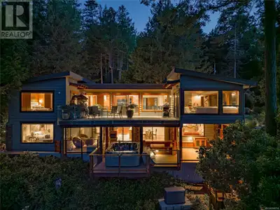 A rare oceanfront retreat with a sought-after deep-water dock—37' x 12' concrete dock and 70' alumin...
