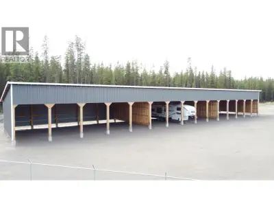 Discover endless potential with this 4.94-acre flat, graveled industrial property. A brand-new cover...