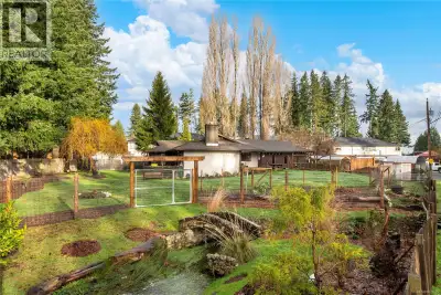 Calling all garden enthusiasts to discover the private and serene oasis awaiting you at 450 Old Pete...