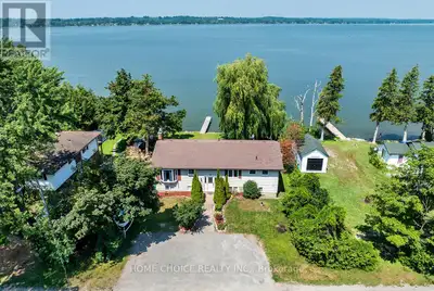 Discover the perfect waterfront residence situated on a spacious 80x100-foot lot facing west, offeri...