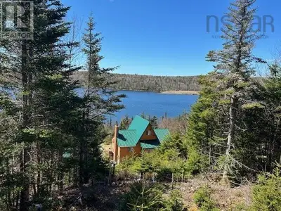 This "Beauty in the Rough" with loads of potential and its spectacular water views sits on a private...