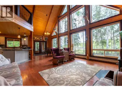 Nestled on 2.15 park-like acres along the banks of the mighty Fraser River, this stunning custom hom...