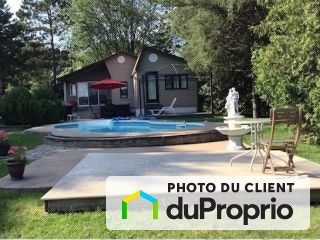 $835,000 - Bungalow for sale in Carignan — photo 1