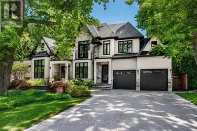 Tucked along one of Ancaster's most cherished tree-lined streets, this exceptional newer home offers...