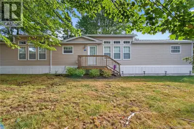 This beautifully maintained 2022 mini home offers 16x12 GARDEN GARAGE modern comfort, thoughtful des...
