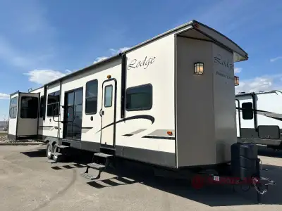 Forest River Wildwood Lodge destination trailer 395RET highlights: Free-Standing Dinette Fireplace D...
