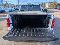 The 2026 Ram 1500 Longhorn Crew Cab in Ivory Tricoat Pearl combines rugged capability with refined l... (image 5)