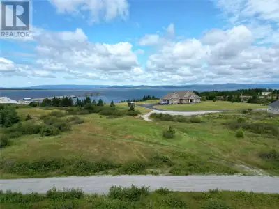 Imagine building your dream home on this beautiful half-acre, level lot! Tucked away in a peaceful a...