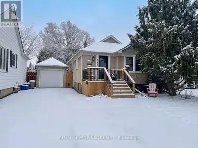 Tastefully renovated 2+1 bedroom bungalow featuring an in-law suite configuration, a detached garage...