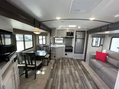 Keystone Bullet travel trailer 248RKSWE highlights: Rear Kitchen Dual Entry Queen-Size Bed Sleeps Fi...