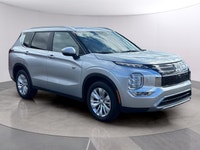 Introducing the 2026 Mitsubishi Outlander Plug-In Hybrid SE S-AWC, gliding in with a captivating sil... (image 1)