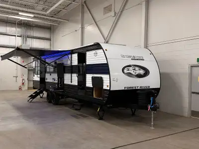 The 2025 Cherokee Grey Wolf 24RRT is a comfortable and versatile travel trailer toy hauler designed...