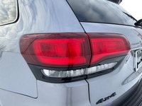 Make a bold, blacked-out statement with this 2021 Jeep Grand Cherokee Altitude. This popular trim le... (image 9)