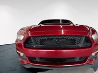 The 2016 Ford Mustang GT in vibrant red with a rear-wheel-drive setup promises dynamic handling and... (image 2)
