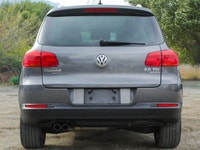 The 2012 Volkswagen Tiguan Highline in its sophisticated gray hue, paired with an agile AWD drivetra... (image 3)