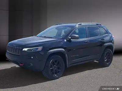 Le Jeep Cherokee Trailhawk 2021 est un SUV conçu pour les amateurs d'aventure et de conduite hors ro...