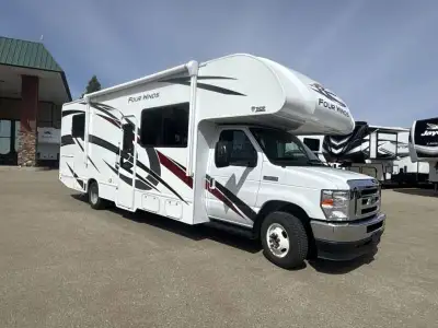 Thor Motor Coach Four Winds Class C gas motorhome 28Z highlights: Walk-Around Queen Bed Mid-Coach En...