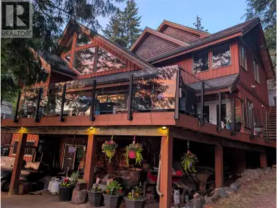 Rare opportunity to own a waterfront home in the highly sought-after Woolford Point on Adams Lake, w...