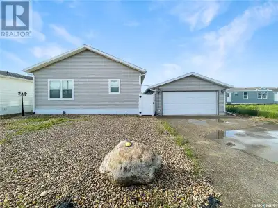 Discover this exquisite home featuring a spacious kitchen and dining area adorned in elegant earth t...